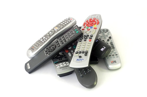 This pile of remotes is now obsolete with DIRECTV Commercial iPad App