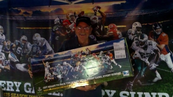 Winner of the NFL Sunday Ticket Marketing kit at the House of Football Fan Appreciation Party