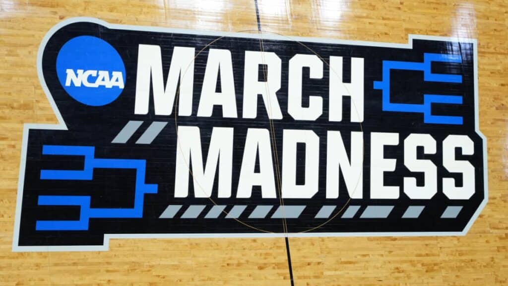 NCAA March Madness Men's Basketball Tournament logo on basketball court - from Its All About Satellites
