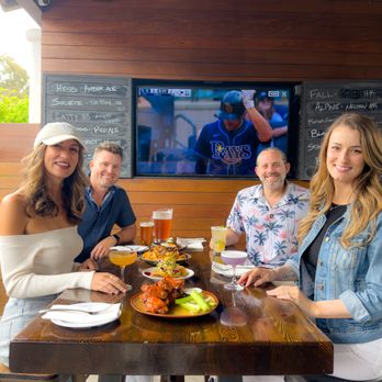 Sports Bar with Fans enjoying food and drinks during a baseball game - DIRECTV FOR BUSINESS from Its All About Satellites